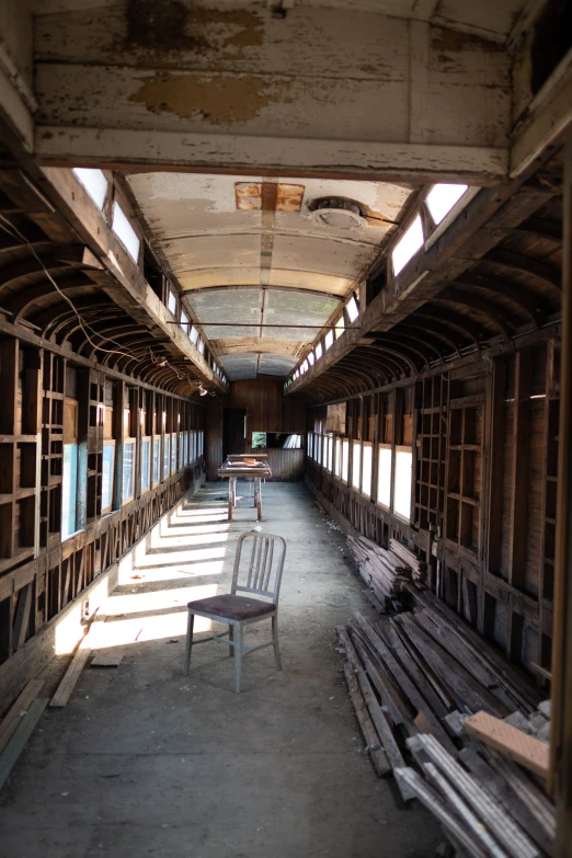 the inside of an old abandoned building with a bench on it