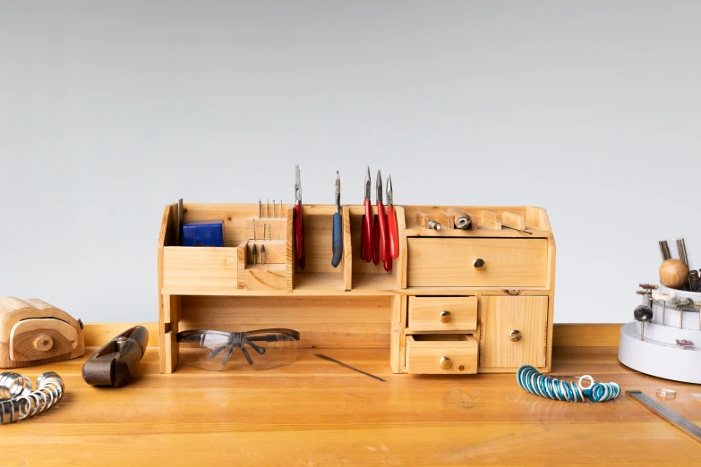 a table with several pieces of wood and various tools on it