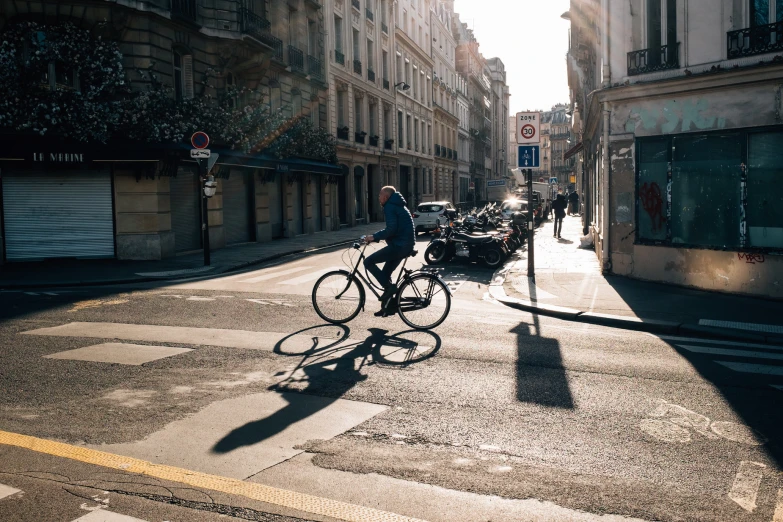 person riding a bike on a city street