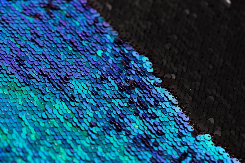 a piece of clothing covered with colorful iridescents