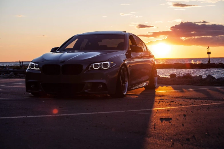 a car parked in a lot during sunset