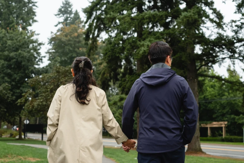 an image of a man and woman holding hands