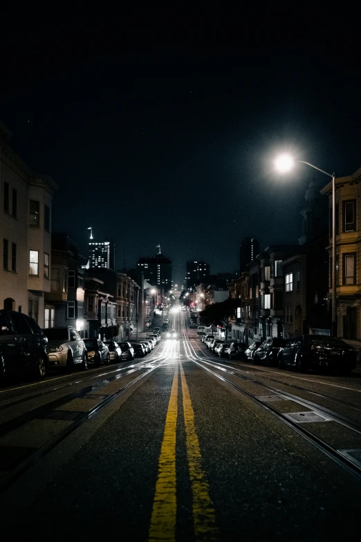 the night view of cars on the street