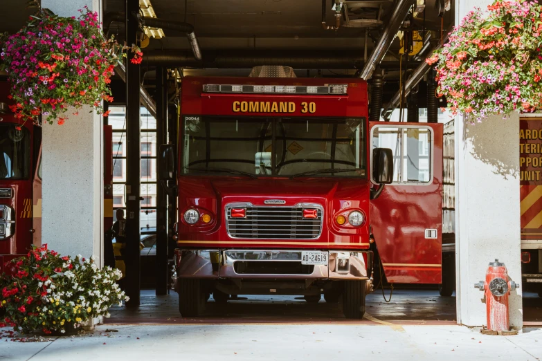 a big red fire truck sitting in a garage