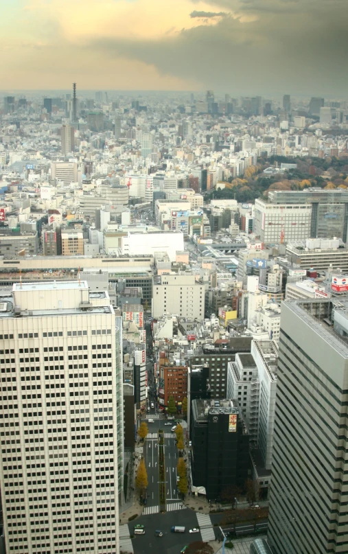 an overhead view of a city with large skyscrs