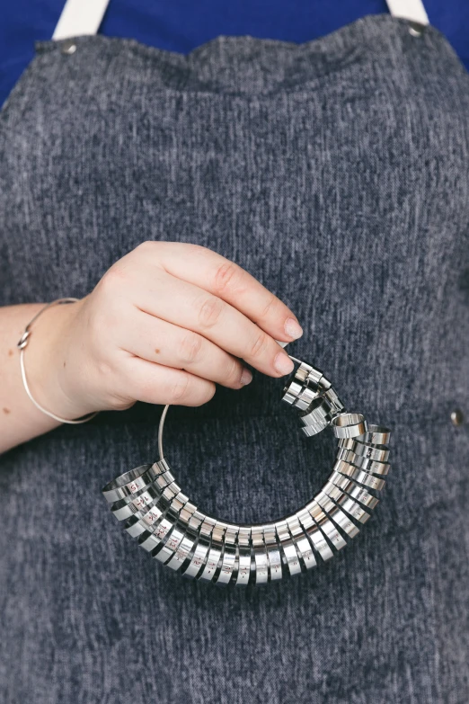 someone with some kind of metal thing in their hand