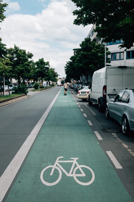 a bike lane with an image of a bicycle on the side