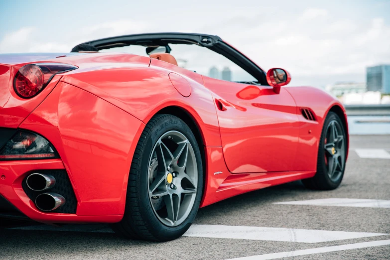 a close up s of the back end of a red sports car