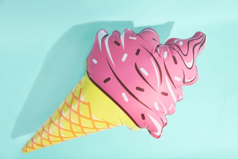 a paper craft ice cream cone is on a blue background