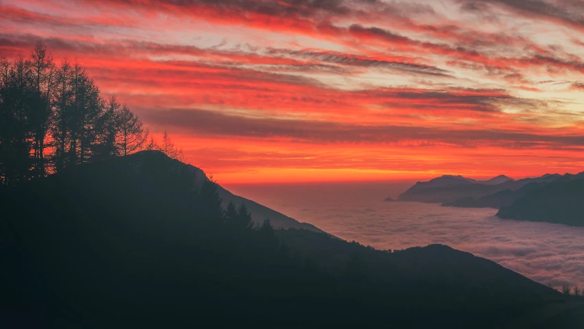 the clouds are flying in to the sunset