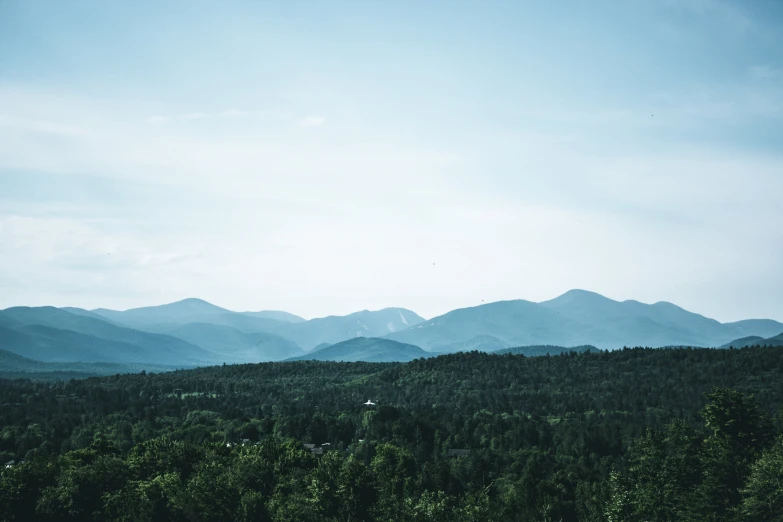 the trees and mountains are visible from the distance