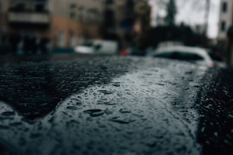 a wet street that has cars on it