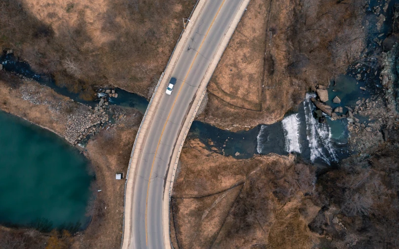 an aerial s shows the curve of a highway