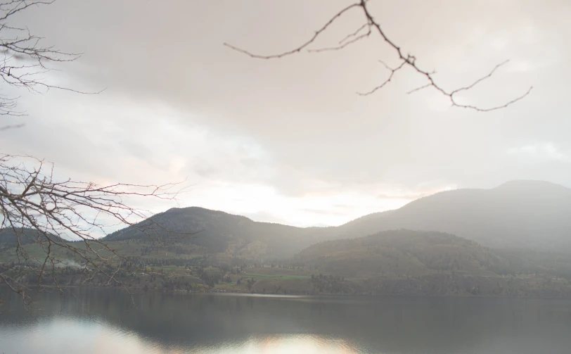 a mountain range over looking a lake in the day