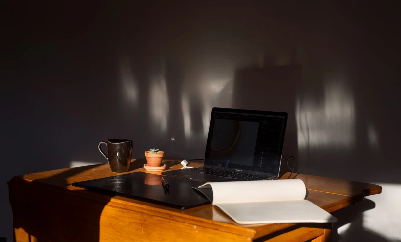 a computer that is sitting on a wooden desk