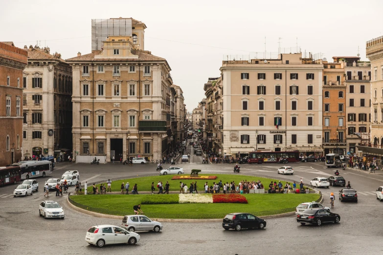 a circular lawn in the middle of a city area