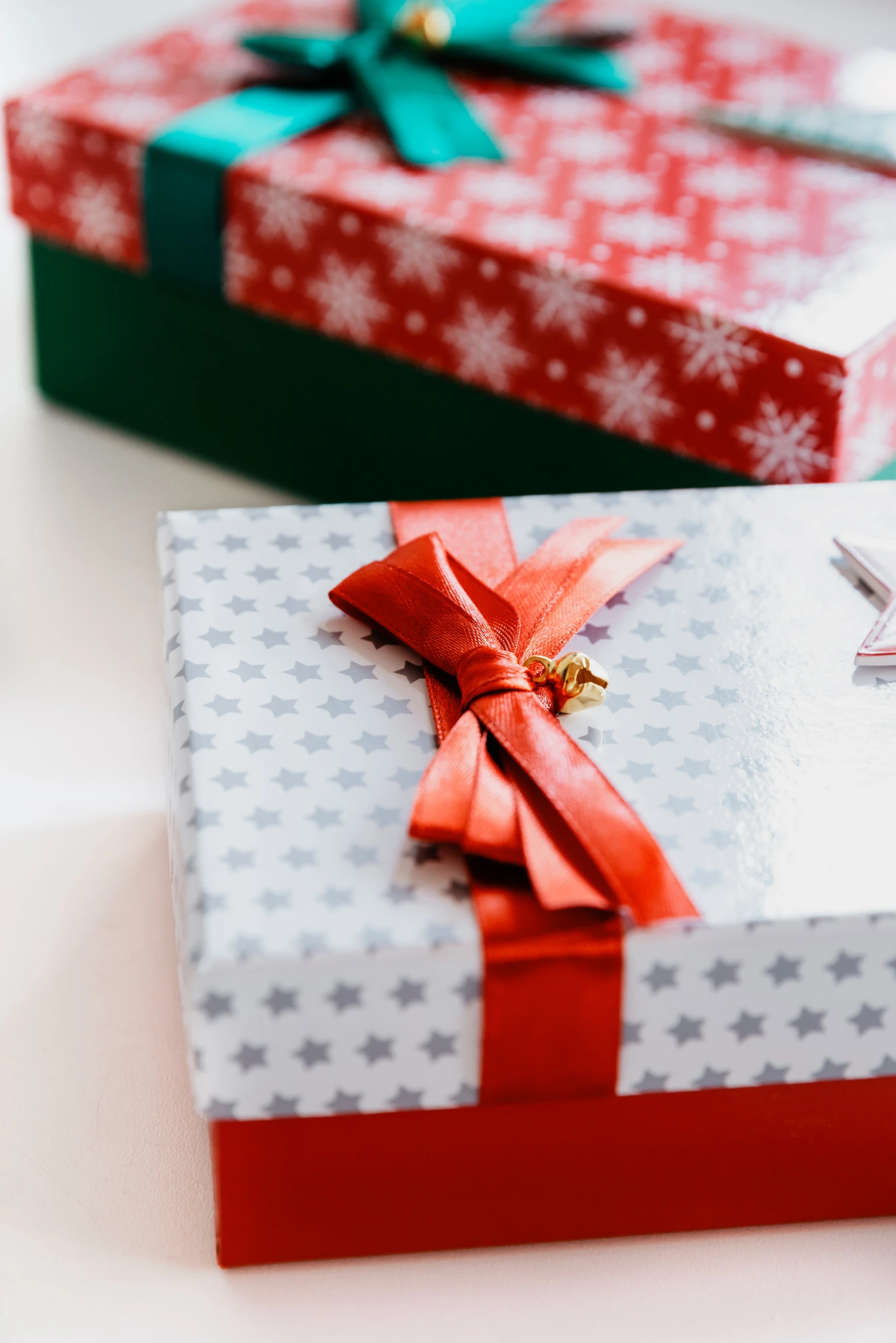 a close up of two present boxes on top of a table