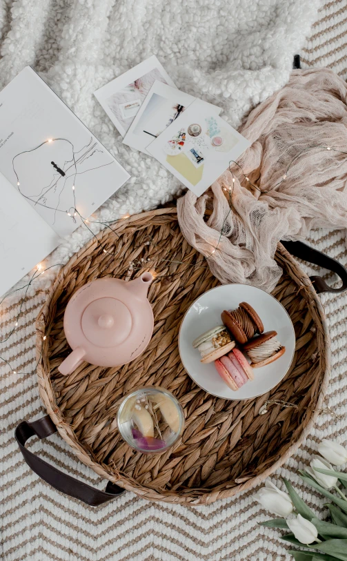 breakfast is served on a basket with flowers