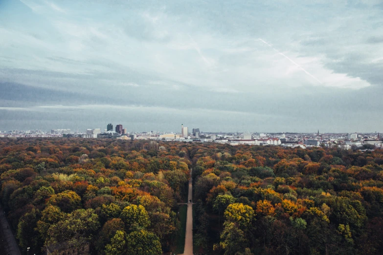 a city is seen in the distance from an aerial view