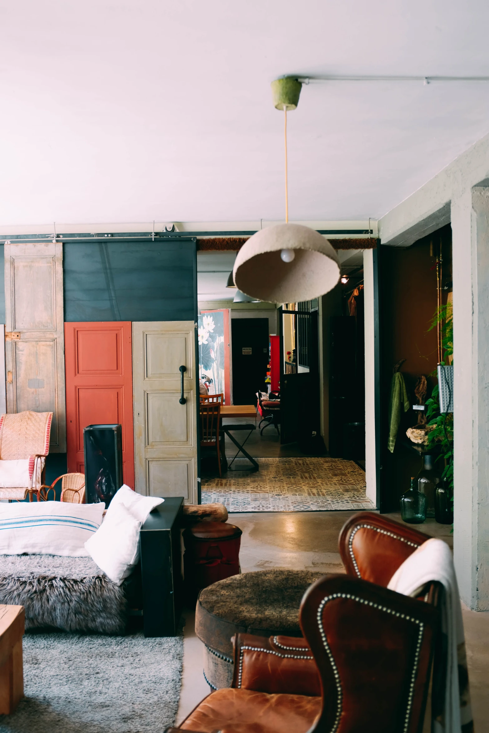 a bedroom filled with furniture and walls painted brown