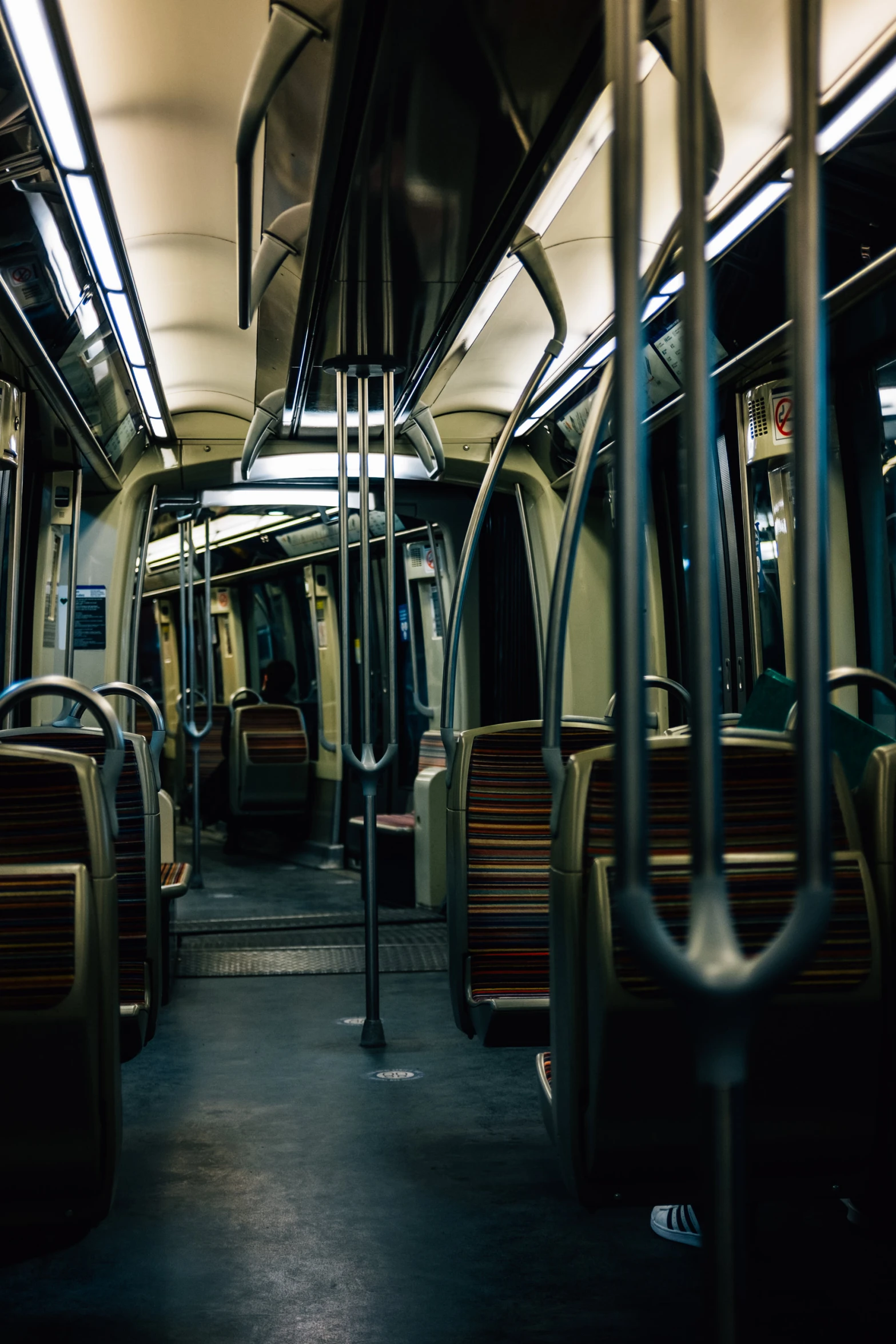 a long train that is traveling through some buildings