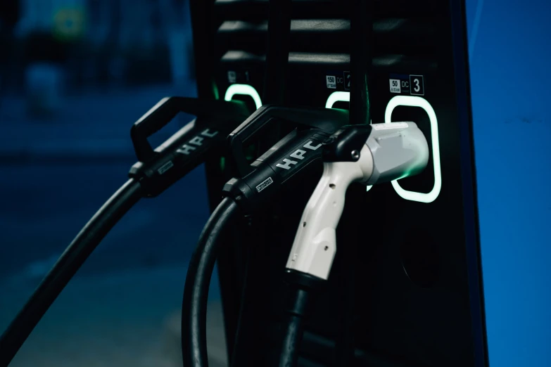 an electric car charging on a street at night