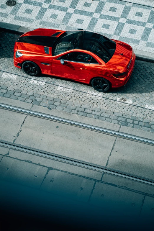 a red sports car parked on the street