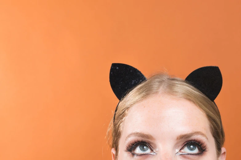 a woman with cat ears on her head