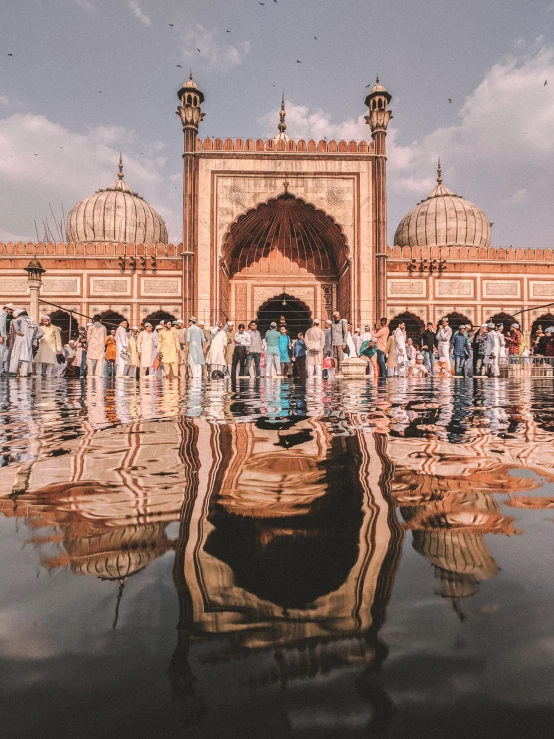 a couple of people that are standing in the water