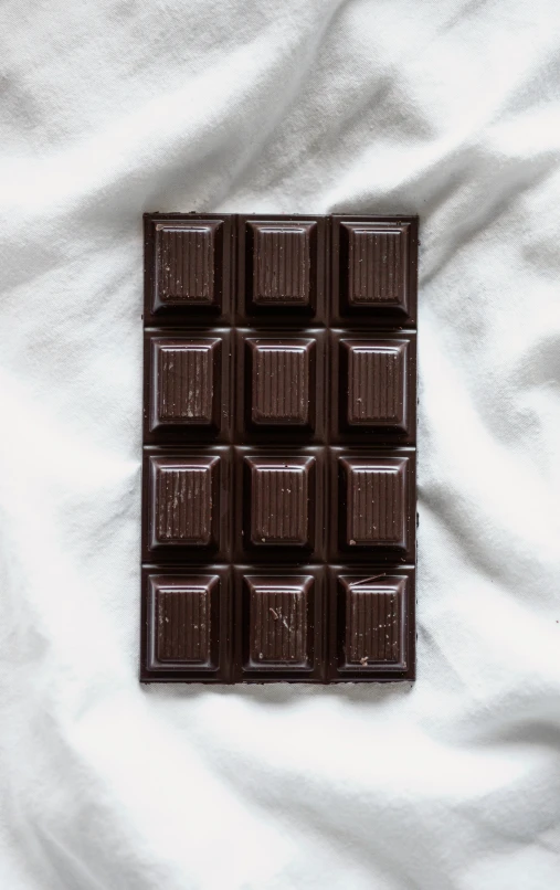 a chocolate bar with an eight sectioned chocolate on the bottom