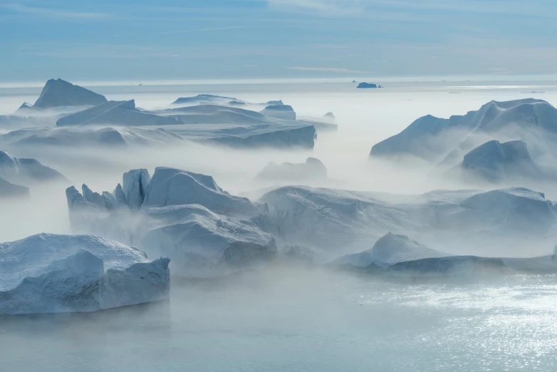 a view of ice and fog over water in a large amount