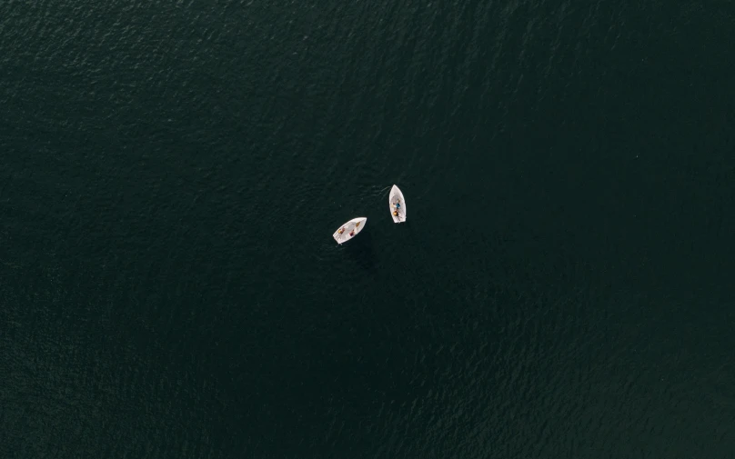 two small boats on open waters in the ocean