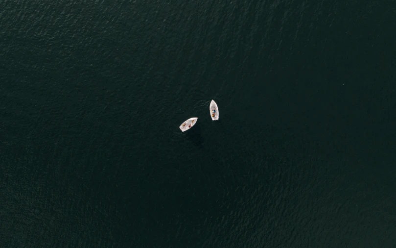 two small boats on open waters in the ocean