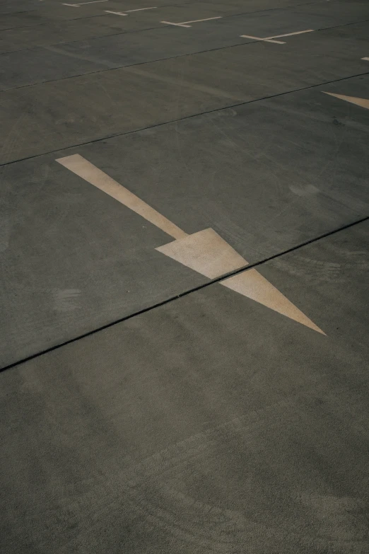 an airplane shadow on the tarmac as it gets ready for takeoff