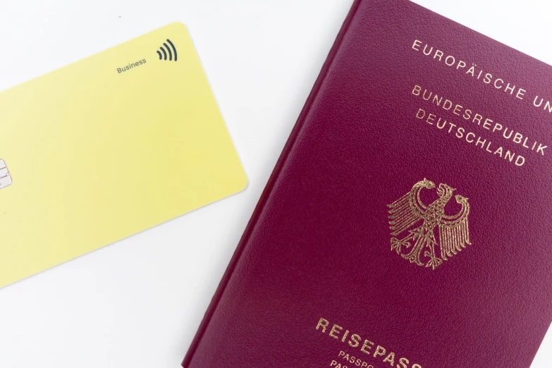 an austrian passport, next to a visa