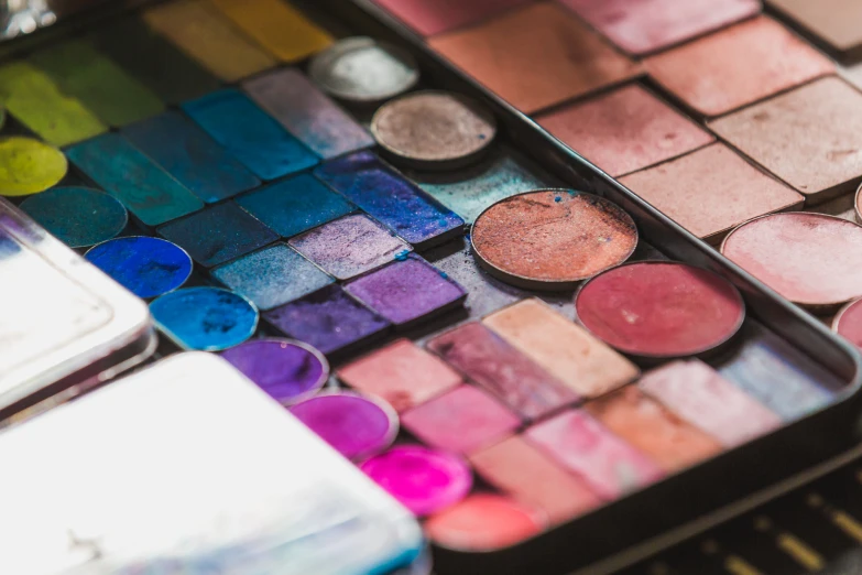 a colorful palette sitting on top of a wooden table