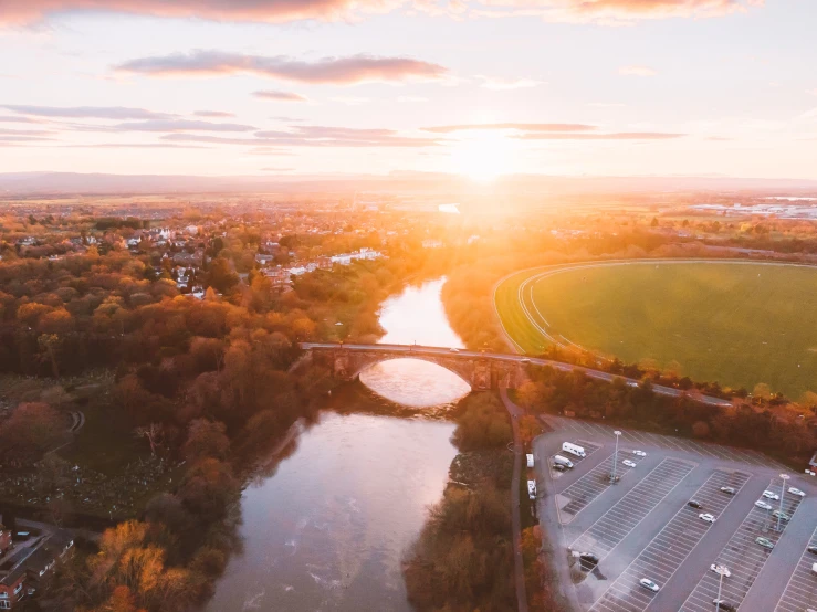 an aerial view of the sky and water, with a river running through it