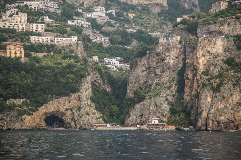 this is a view of a cliff side town from the ocean