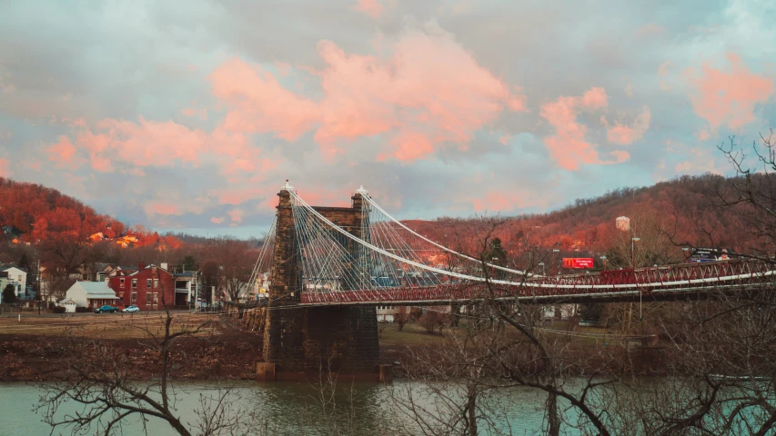 view of a suspension bridge spanning over the river