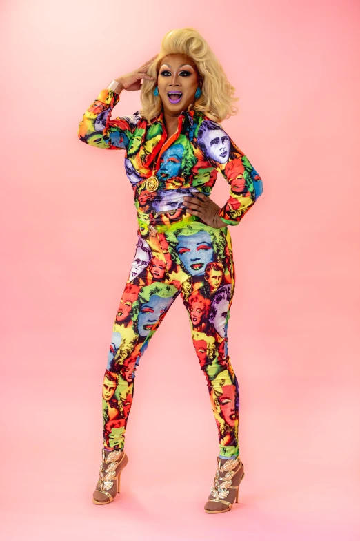 the woman is posing for the camera in colorful clothing