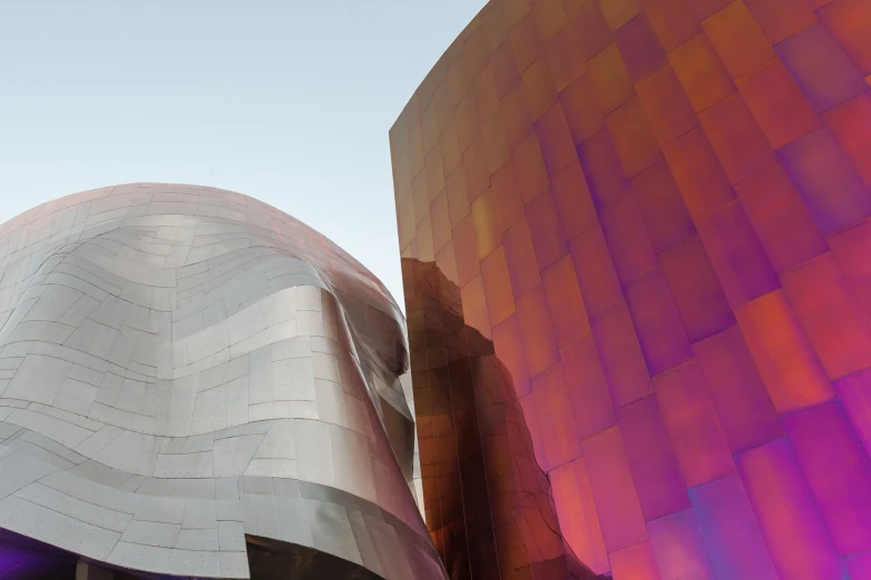 an artisticly designed building with purple light