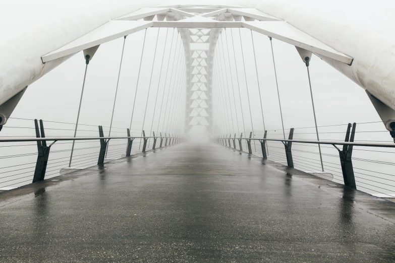 a bridge that is very tall and has a sky way above