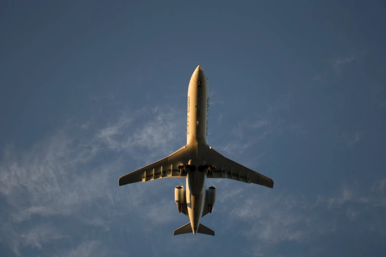 there is a large airplane that is flying in the air