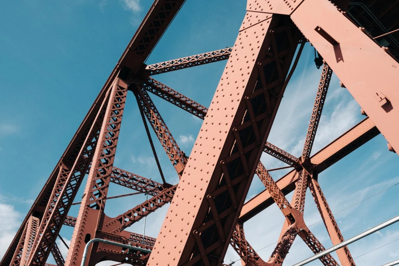 an old metal structure against a blue sky