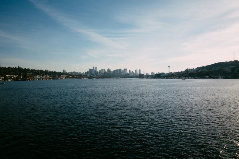 there is a large body of water with buildings on the shore