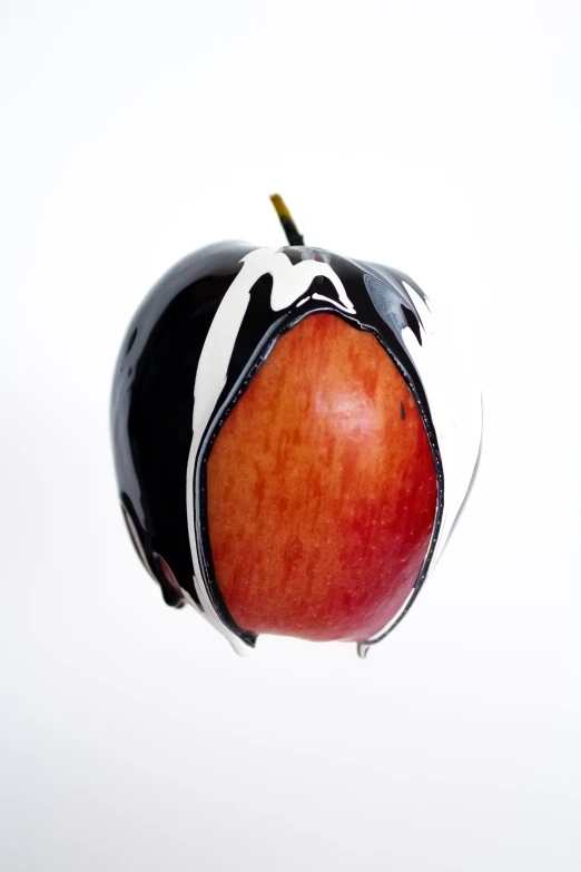 a red apple with stripes and a large apple inside