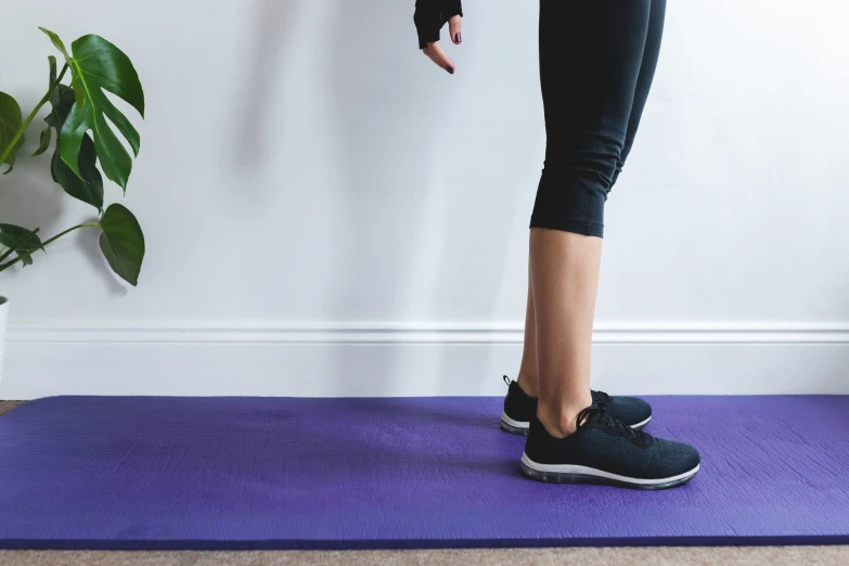 there is a person doing a yoga exercise on the mat