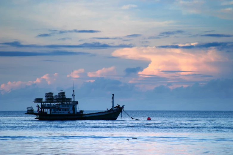 the large boat is docked in the ocean