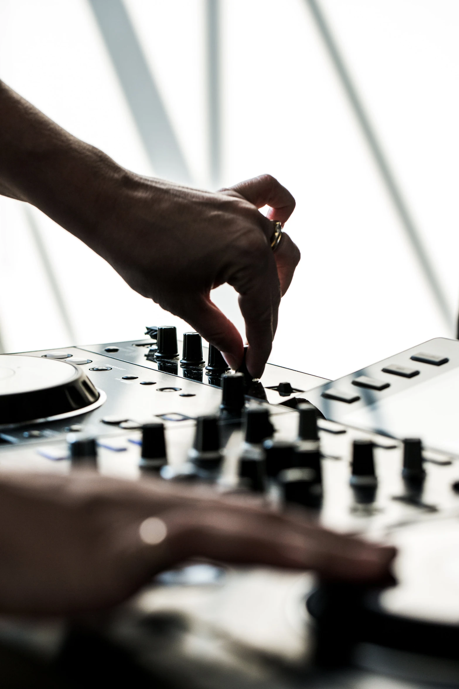 someone using the hands of a dj on a turntable