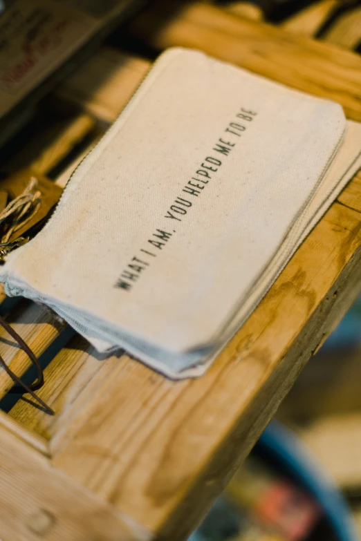 an old, run down paper folder on a wooden table